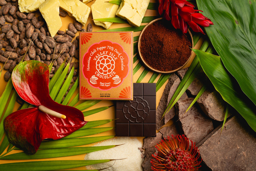 Box of chocolate with a bar on a leafy background