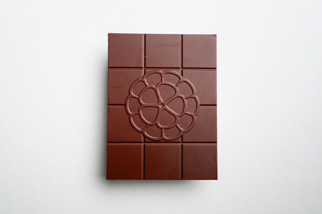 Chocolate bar with a decorative design on a white background