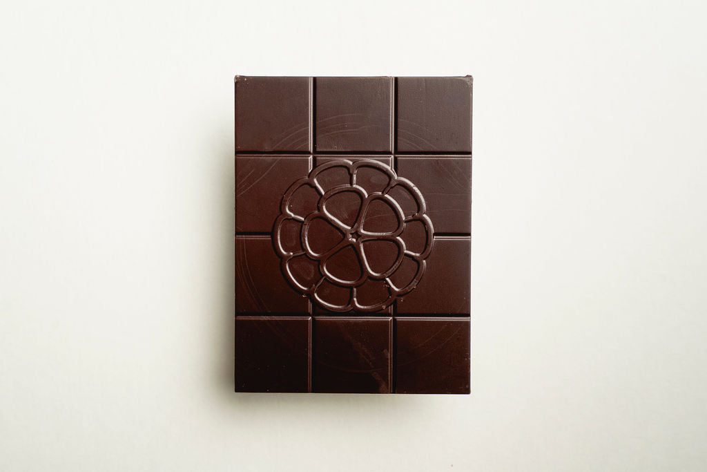 Chocolate bar with a geometric design on a light beige background
